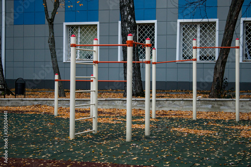 Sports ground with exercise equipment for the physical development of children and adults