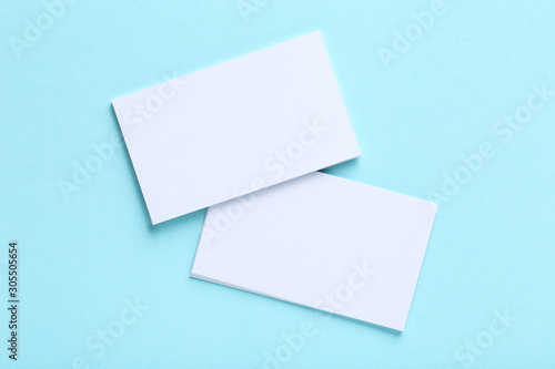 Blank business cards on blue background