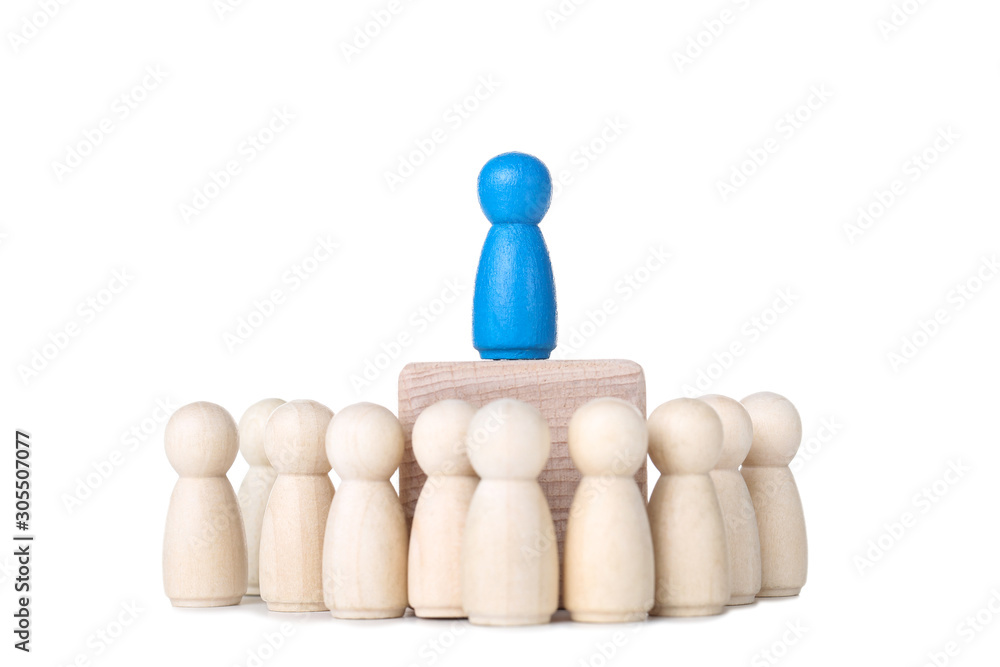 Leader concept. Wooden figures on white background Leader concept. Wooden figures on white background