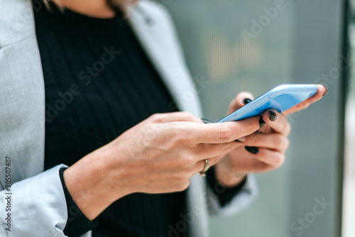 Close-up of woman using cell phone outdoors