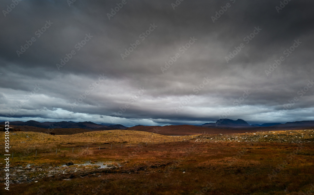 Dark storm clouds building over the Torridon mountains in winter  in the North West Highlands of Scotland, UK.