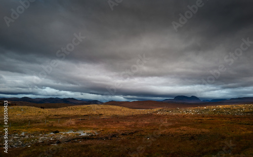 Dark storm clouds building over the Torridon mountains in winter in the North West Highlands of Scotland, UK.