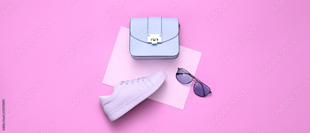 Fashion Girl Outfit. Woman Accessories Set. Minimal Creative Hipster pink Flat lay. Fashion sneakers shoes, Trendy purple Handbag, Glamour fashionable Sunglasses on pink - obrazy, fototapety, plakaty 