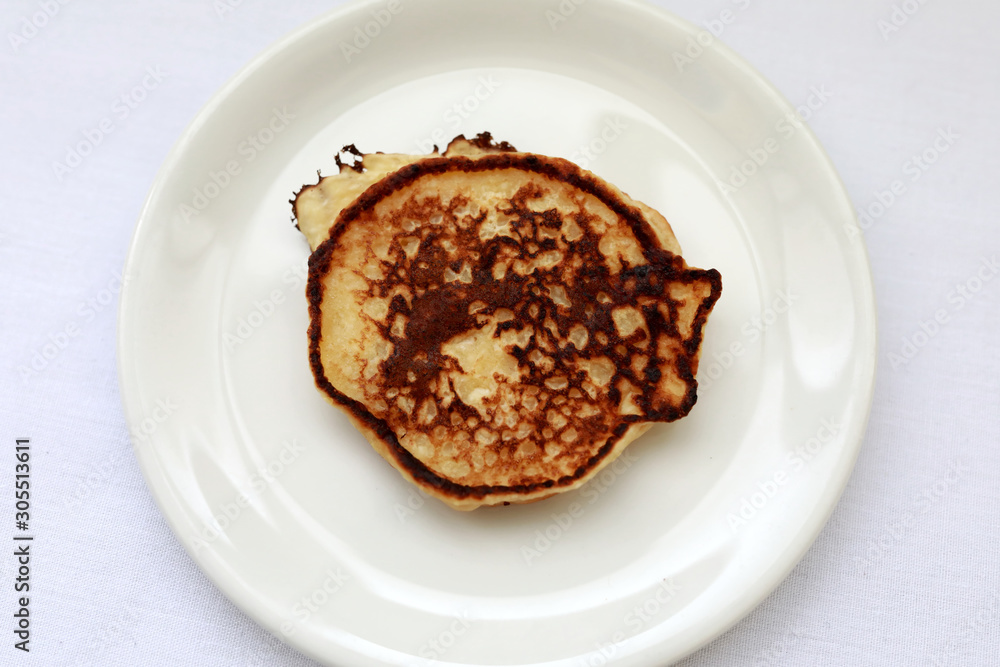 White plate with pancake White plate with pancake