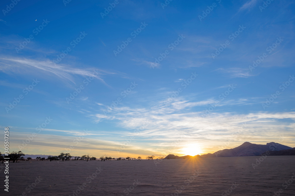 Sunrise at dry barren desert