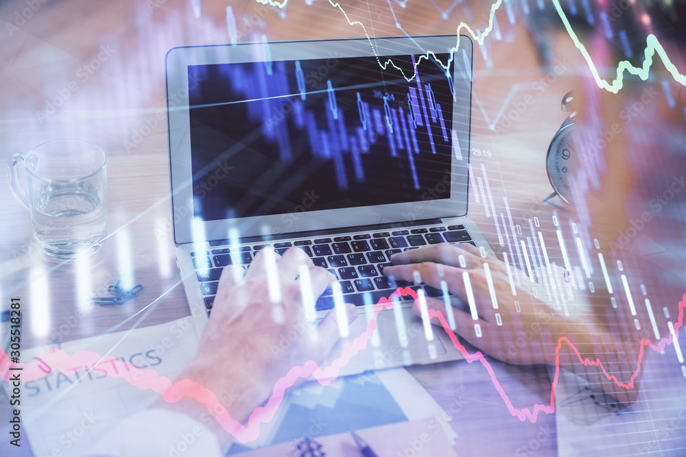 Multi exposure of forex graph with man working on computer on background. Concept of market analysis. Multi exposure of forex graph with man working on computer on background. Concept of market analysis.