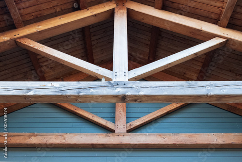 Wooden roof rafter beams. Architectural detail and design.