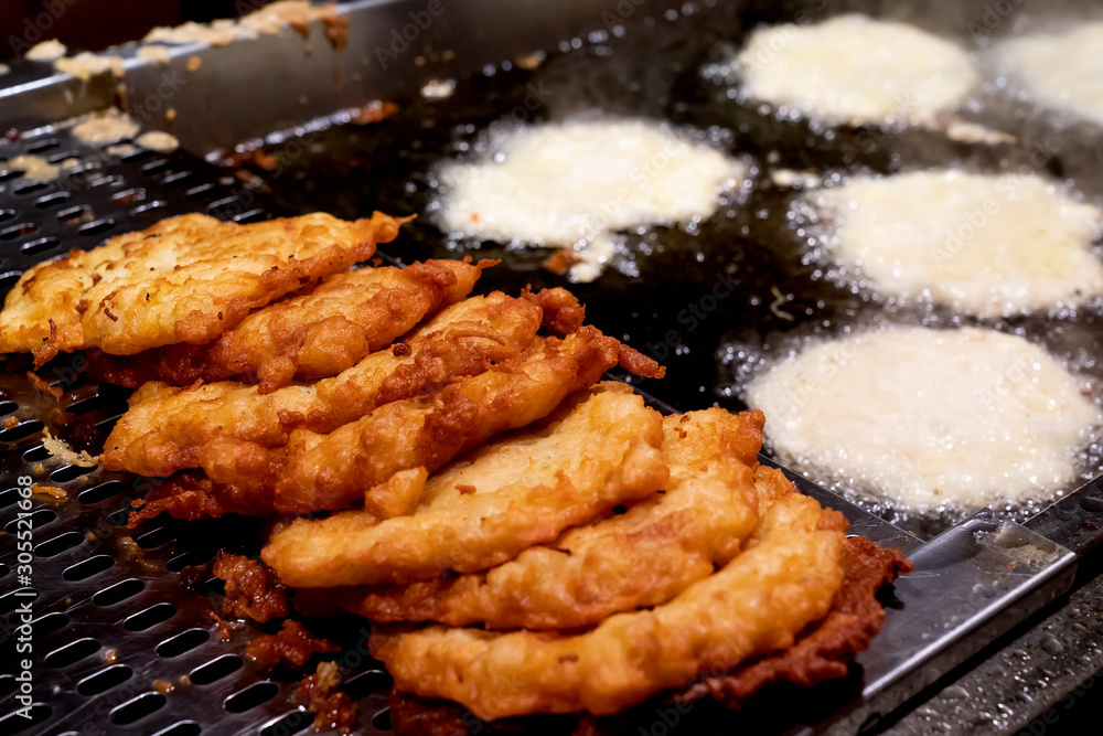 Fresh potato fritters. A popular traditional food at all markets and at home Fresh potato fritters. A popular traditional food at all markets and at home