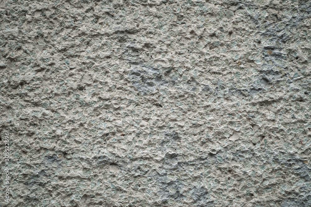 Surface texture of gray stone hewn wall. Surface texture of gray stone hewn wall.