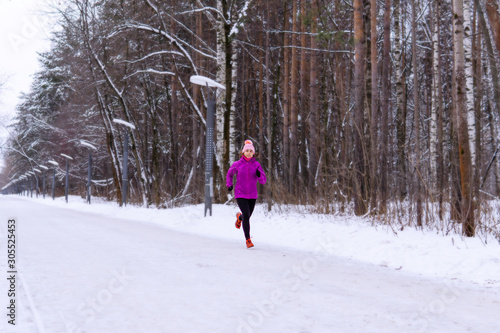 young woman jogging on a winter day