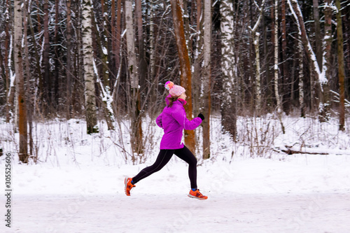 young woman jogging on a winter day