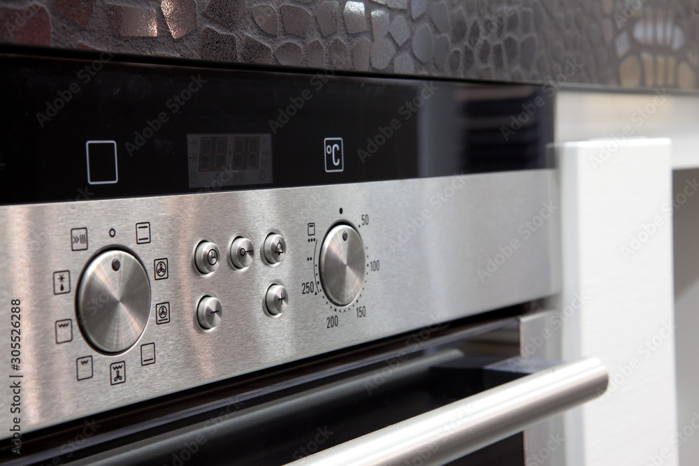 closeup of oven dashboard with grey buttons closeup of oven dashboard with grey buttons