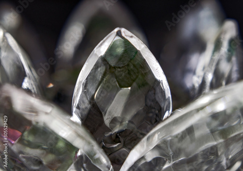 Macro - glass flower photographed in close-up under dim lighting, abstract background