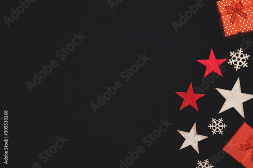 handmade wooden stars and snowflakes isolated on black background, beautiful christmas decoration