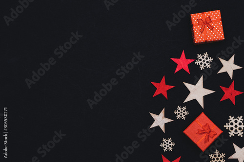 handmade wooden stars, gifts and snowflakes isolated on black background, beautiful christmas decoration