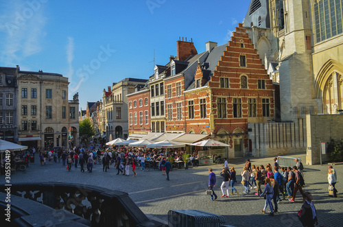 Grote Markt Square in Leuven with People Walking in Sunny Day