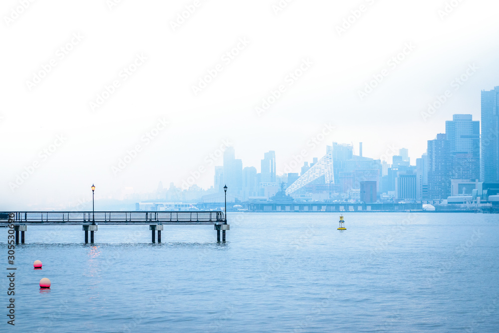 Hazy pier in Hoboken with NYC in the Background