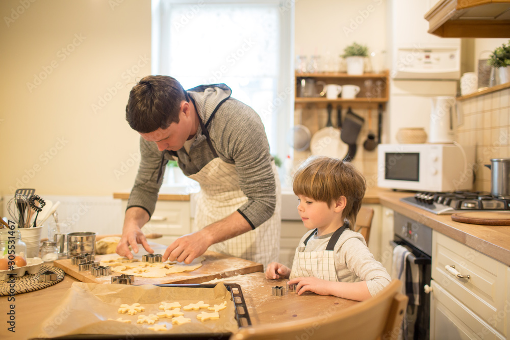 Dad and son make cookies Dad and son make cookies