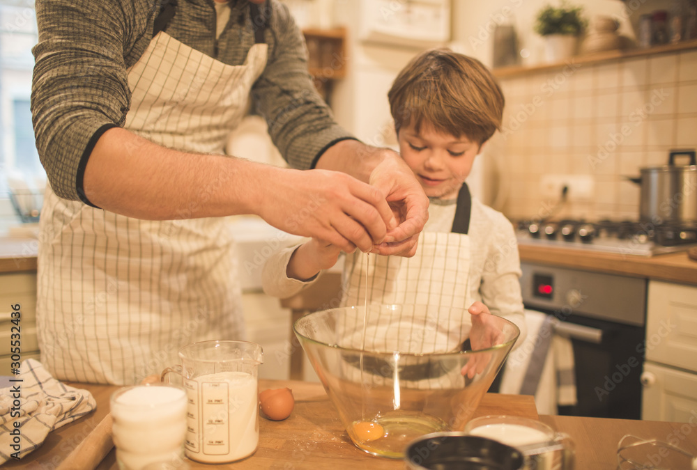 Dad and sons make cookies