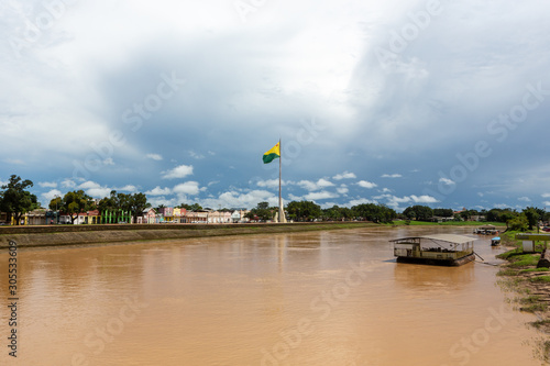 Fotografie Beautiful view of Acre river in the amazon and Gameleira sidewalk of Rio Branco city center on cloudy winter day