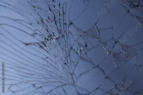 Fototapeta Naklejka Na Ścianę i Meble -  cracked broken mobile screen glass texture background macro