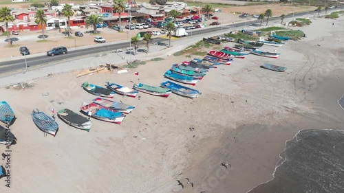 Colorful Boats on the shore beach, pacific ocean coast (Coquimbo, Chile) photo
