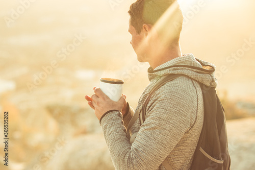 Tourist with a thermos of hot drink