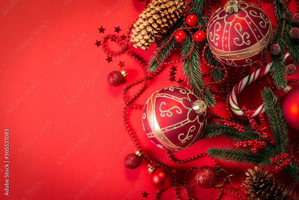 Christmas decorations on red background, top view