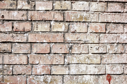 Texture, brick, wall, it can be used as a background . Brick texture with scratches and cracks