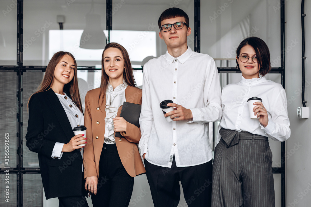 After a long meeting, fellow employees drink coffee After a long meeting, fellow employees drink coffee