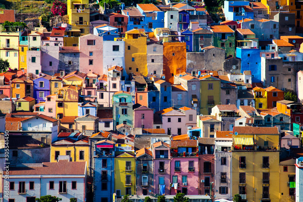 view of the facades of the houses of Bosa known for its characteristic colorful houses, Sardinia, Italy