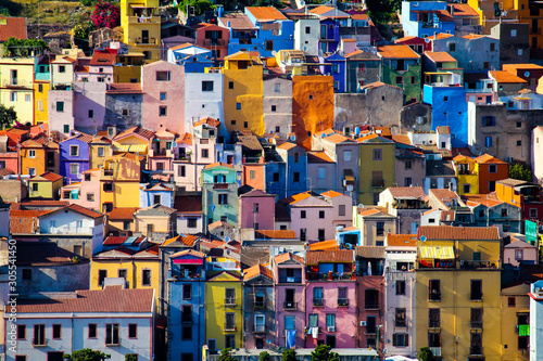 view of the facades of the houses of Bosa known for its characteristic colorful houses, Sardinia, Italy