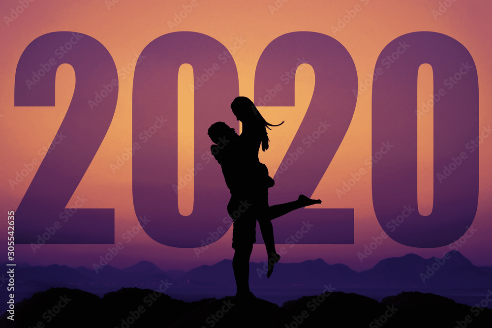 Love couple silhouette with big new year 2020 and sunset Love couple silhouette with big new year 2020 and sunset
