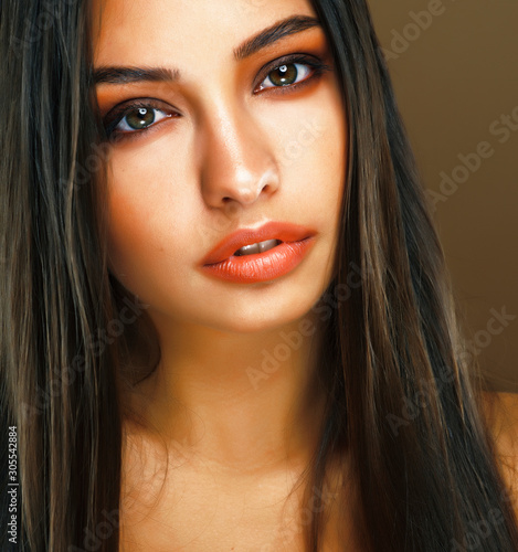 cute happy young indian woman in studio closeup smiling, fashion beauty