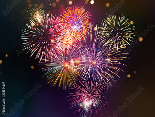 Colorful firework with bokeh background. New Year celebration.