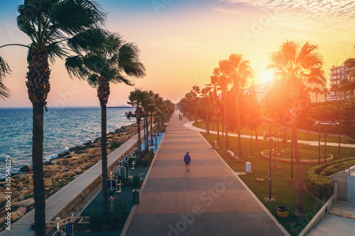 Leinwand Poster Limassol promenade or embankment at sunset