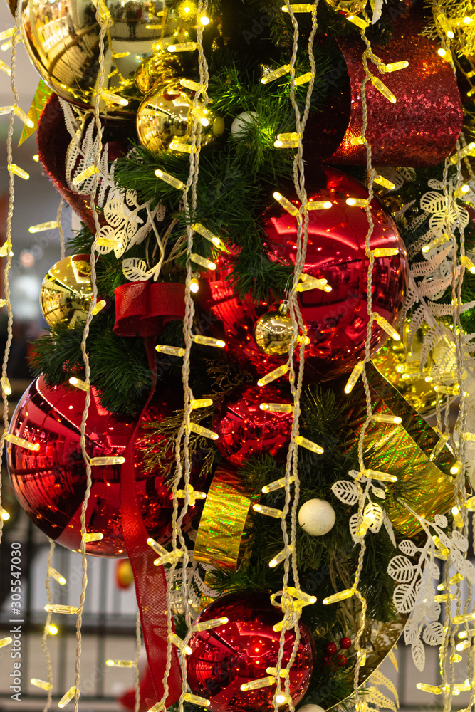 Naklejka premium New Year decorations. Flashlights, colorful balls, tinsel, spruce branches. New years eve