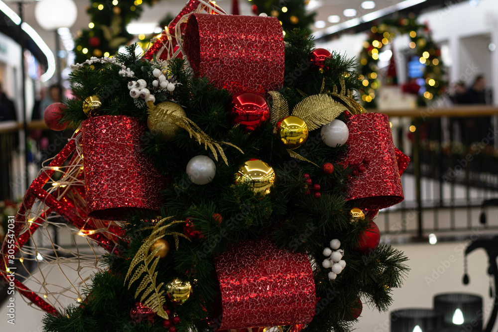 Fototapeta premium Decorative Christmas composition, a large open gift, inside cones and branches of spruce. New Years Eve.
