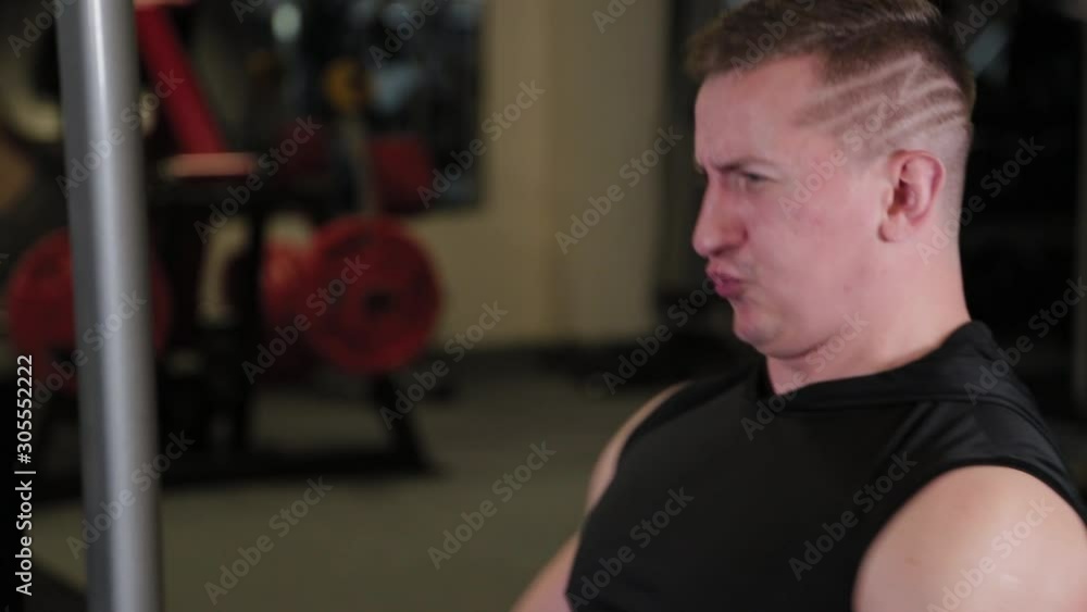 Strong athlete performs a deadlift exercise on a block. Strong athlete performs a deadlift exercise on a block.