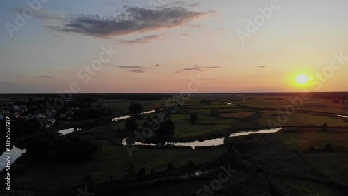 Aerial shot of sunset over Narew river, Poland. photo