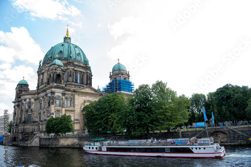Berlin, Germany - July 21, 2019: protestant church seen from river. Cathedral or dom. Religious building. Baroque architecture. Architectural monument. Vacation and travel. Wanderlust. River cruise