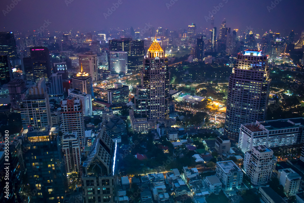 The enlightened skyscrapers of Bangkok skyline during night in Thailand