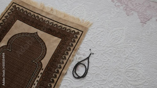 prayer rugs laid out on the carpet, and Islamic prayer rugs,