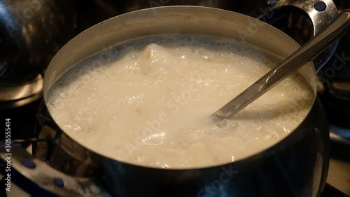 boiling yogurt soup in pot, 120fps slow motion shot,