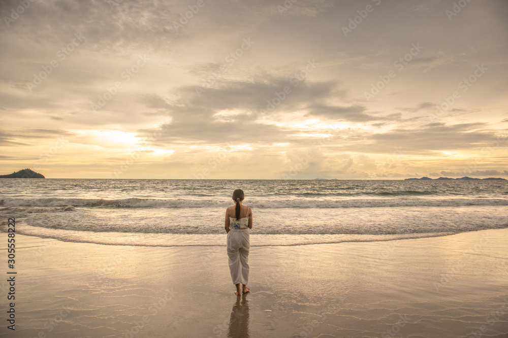 Woman near the ocean.Walking on the beach. Woman near the ocean.Walking on the beach.