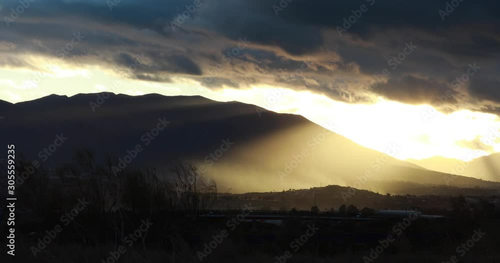 A golden sunset in the mountains with clouds near Málaga, Spain A golden sunset in the mountains with clouds near Málaga, Spain