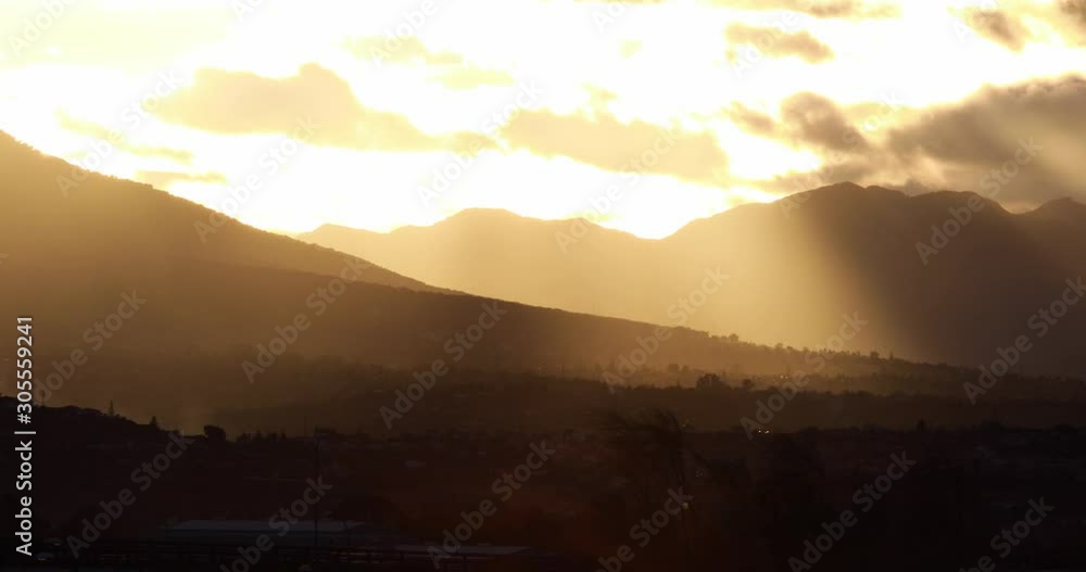 A golden sunset in the mountains with clouds near Málaga, Spain A golden sunset in the mountains with clouds near Málaga, Spain