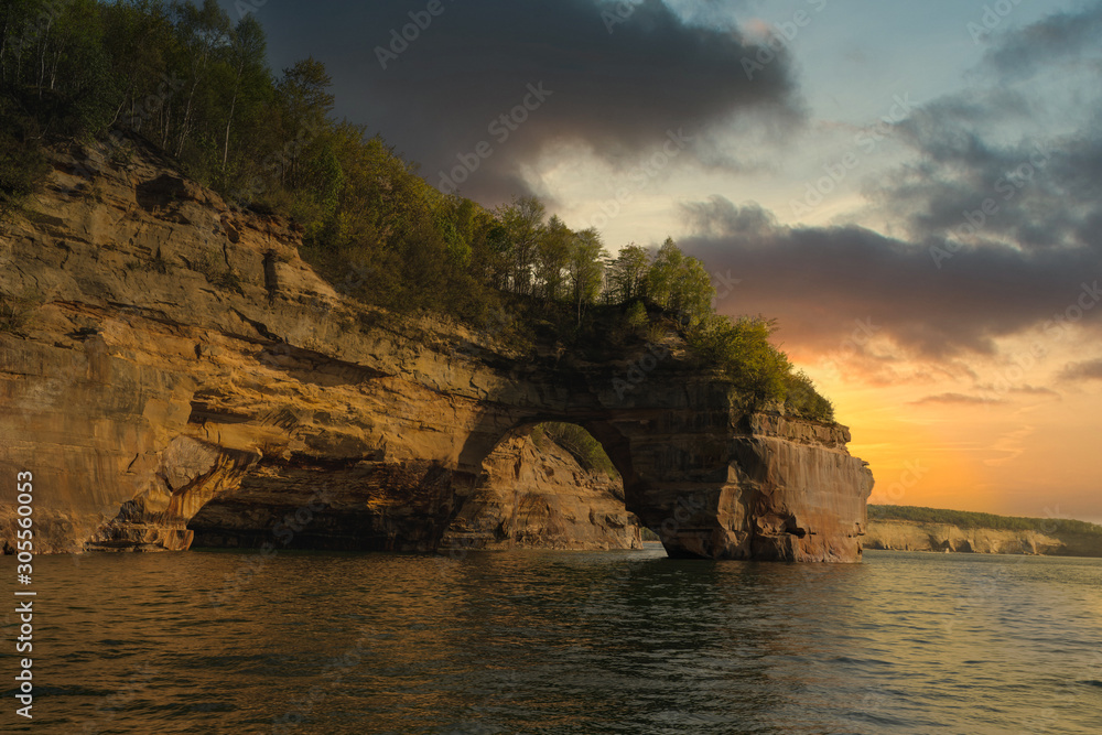 golden skies glow over freshwater caves in the great lakes