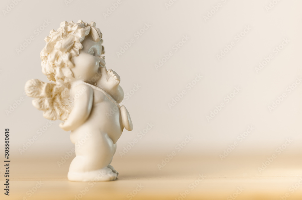 plaster figurine of a little angel with a place for inscription plaster figurine of a little angel with a place for inscription