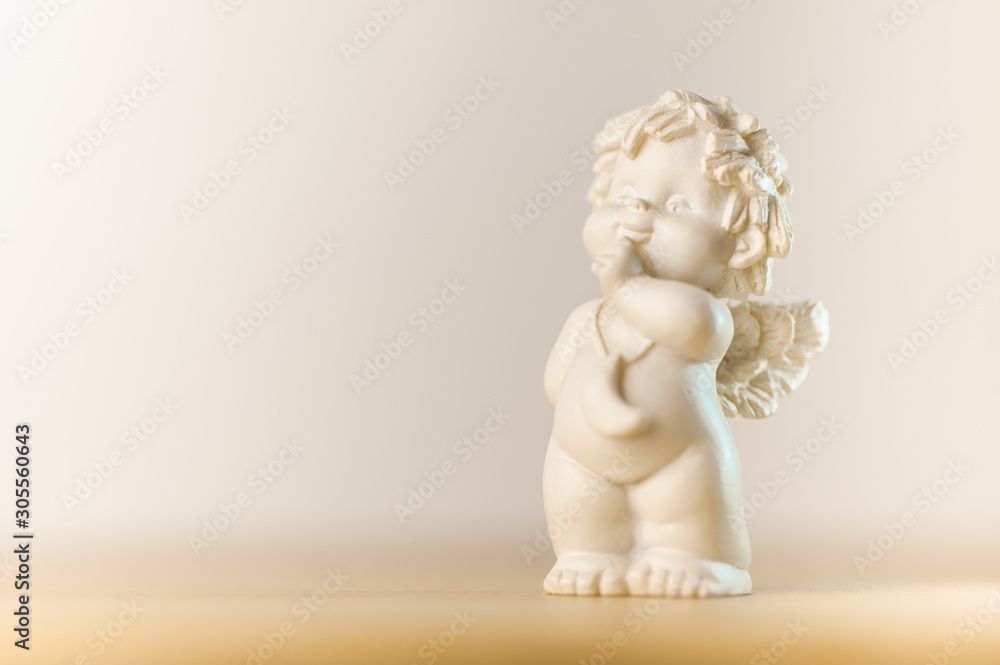 plaster figurine of a little angel with a place for inscription plaster figurine of a little angel with a place for inscription